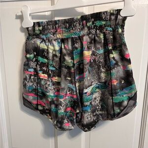Lululemon Hotty Hot 4” short, size 4. Multi-colored pattern.